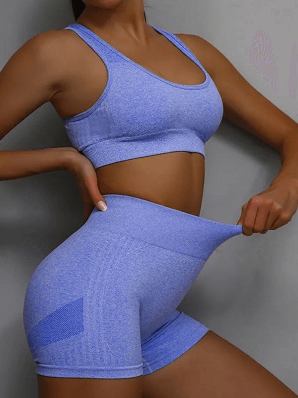 Breathable elastic women's sports bra and shorts set in blue, offering comfort for yoga and exercise.